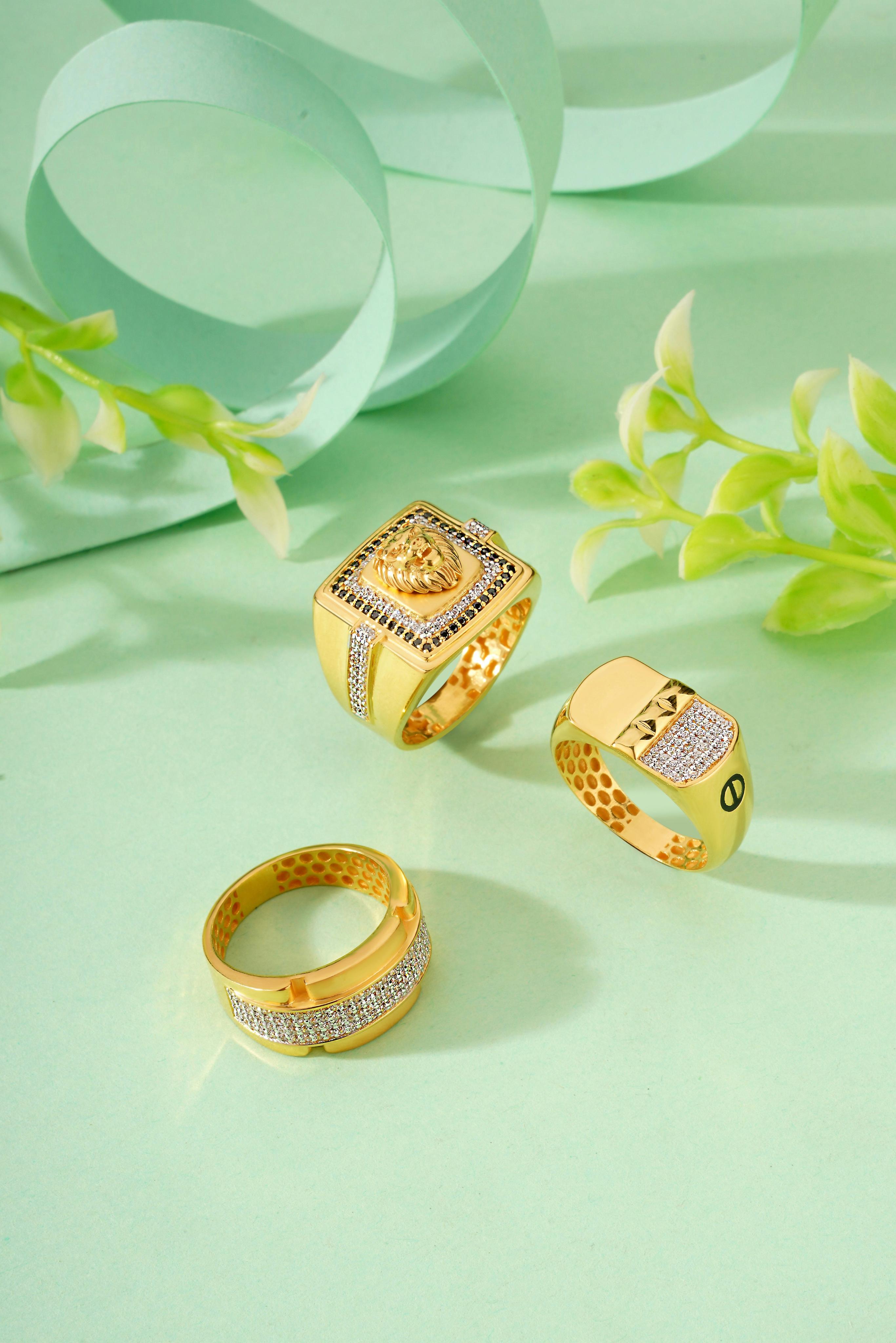 Golden rings on a green background